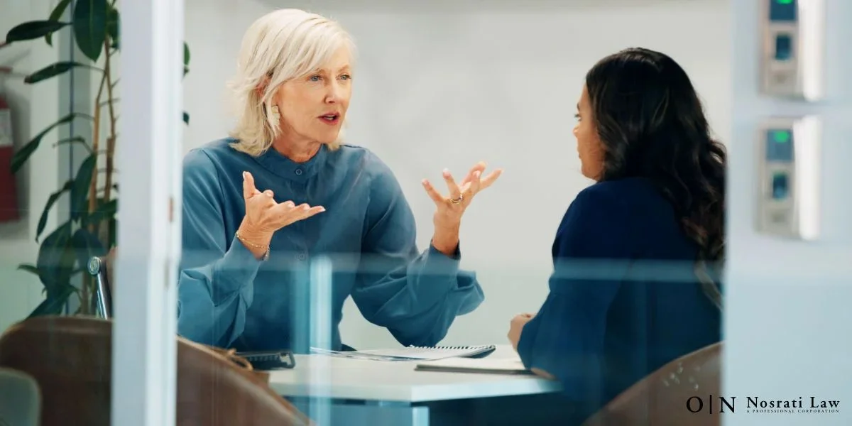 An attorney actively discusses a case with a client in an office